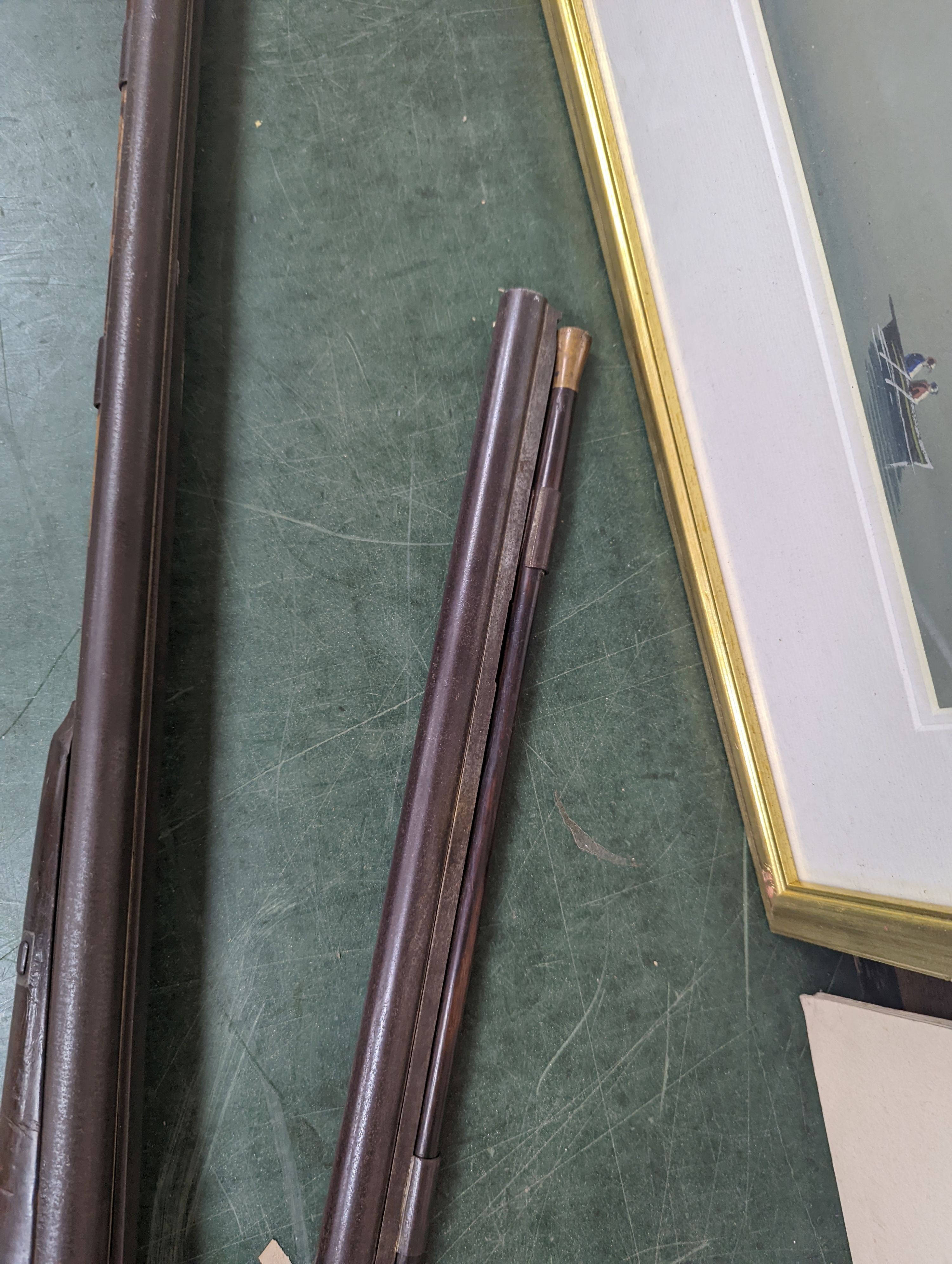 Two 19th century percussion muskets, 103cm. max., one double-barrelled